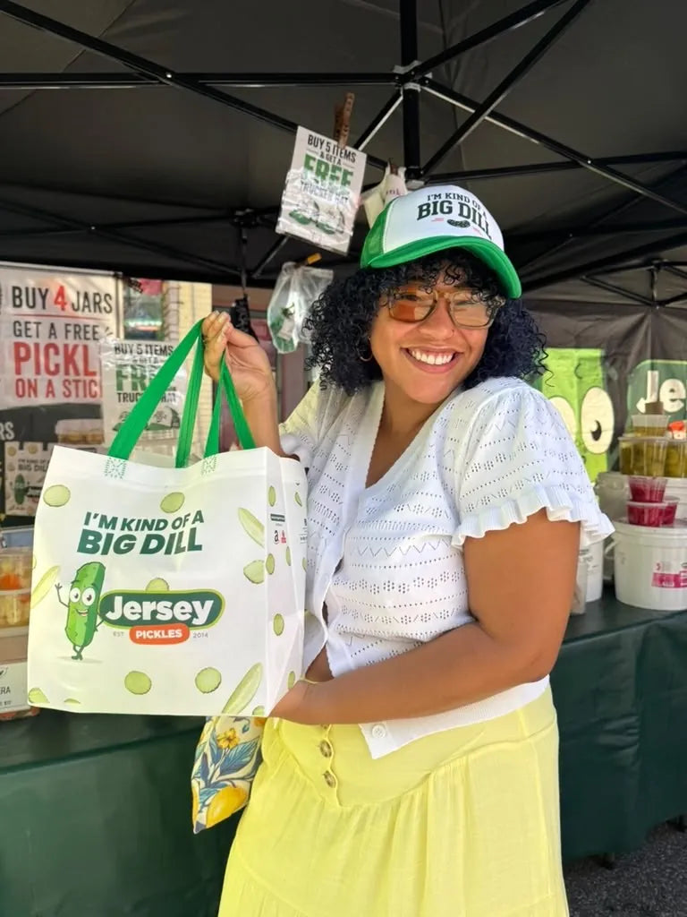 Customer with an I’m Kind of a Big Dill tote at the Jersey Pickles stand