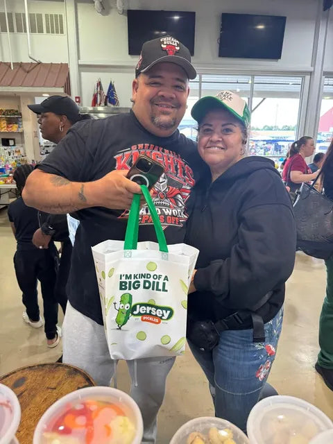 Two customers with a Jersey Pickles tote at an indoor market